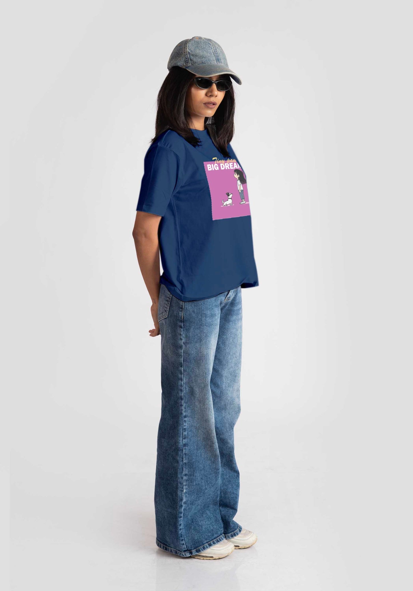 Stylera cute print blue t-shirt for women worn with light denim jeans and cap