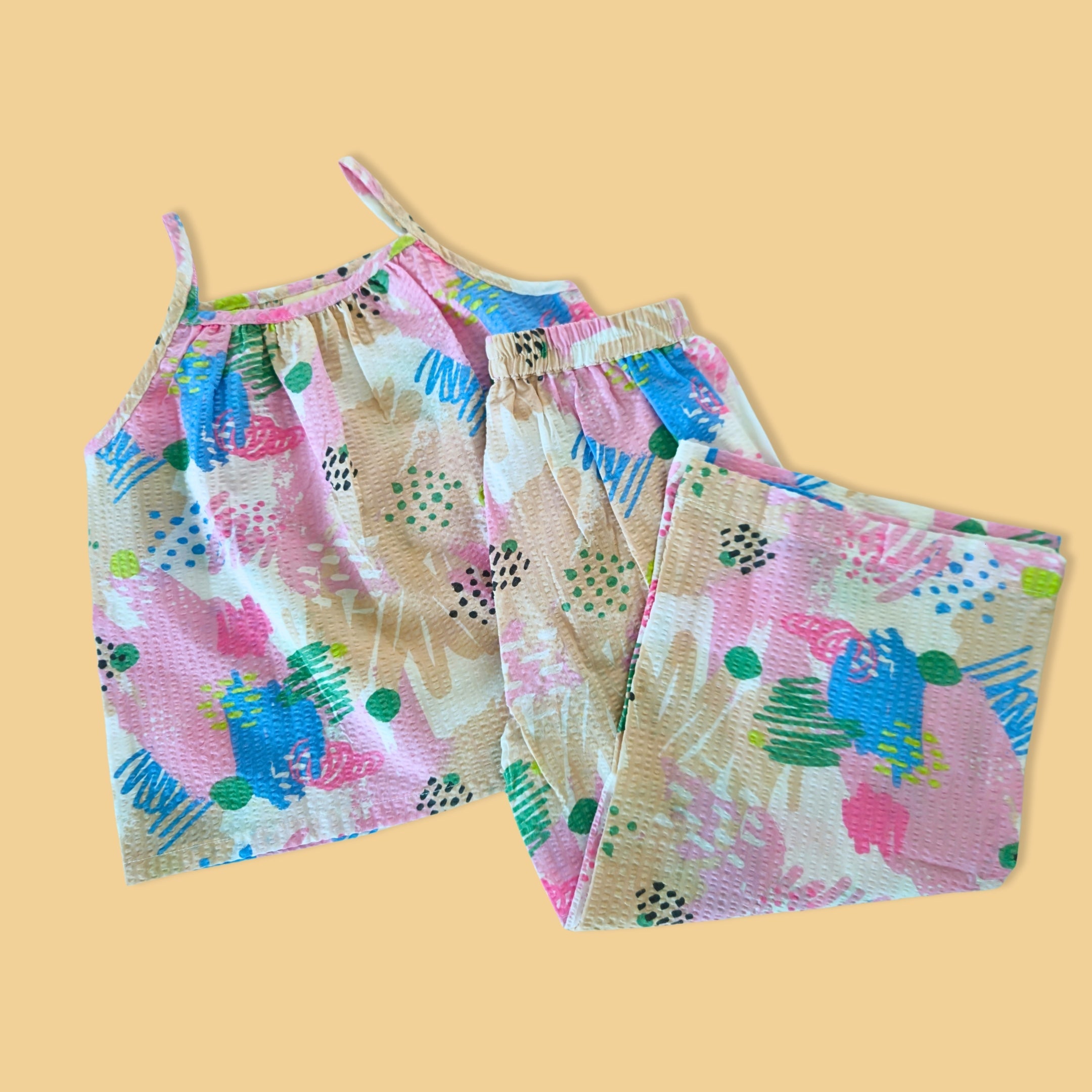 Cute printed pajama set for girls in colorful patterns with a sleeveless top and matching pants
