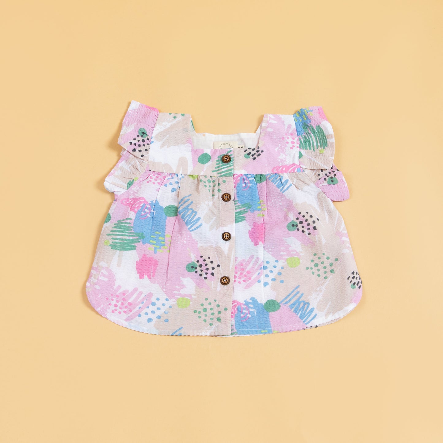 Colorful Stylera shirt featuring ruffled sleeves, ideal as a cute summer outfit for kids