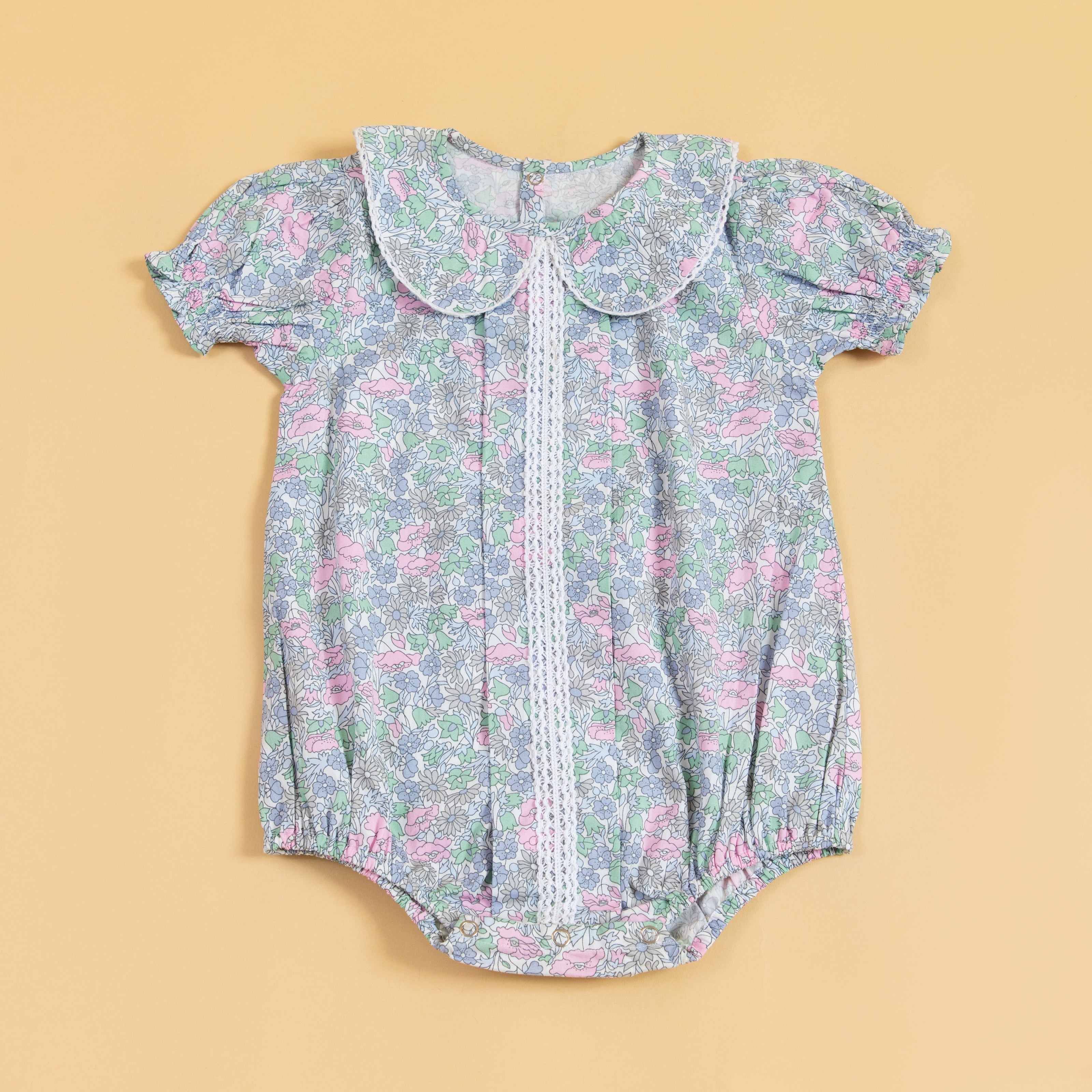 Adorable Stylera cute summer romper for babies with floral design and puff sleeves