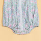 Cute summer romper for babies with floral print and lace details in pastel colors