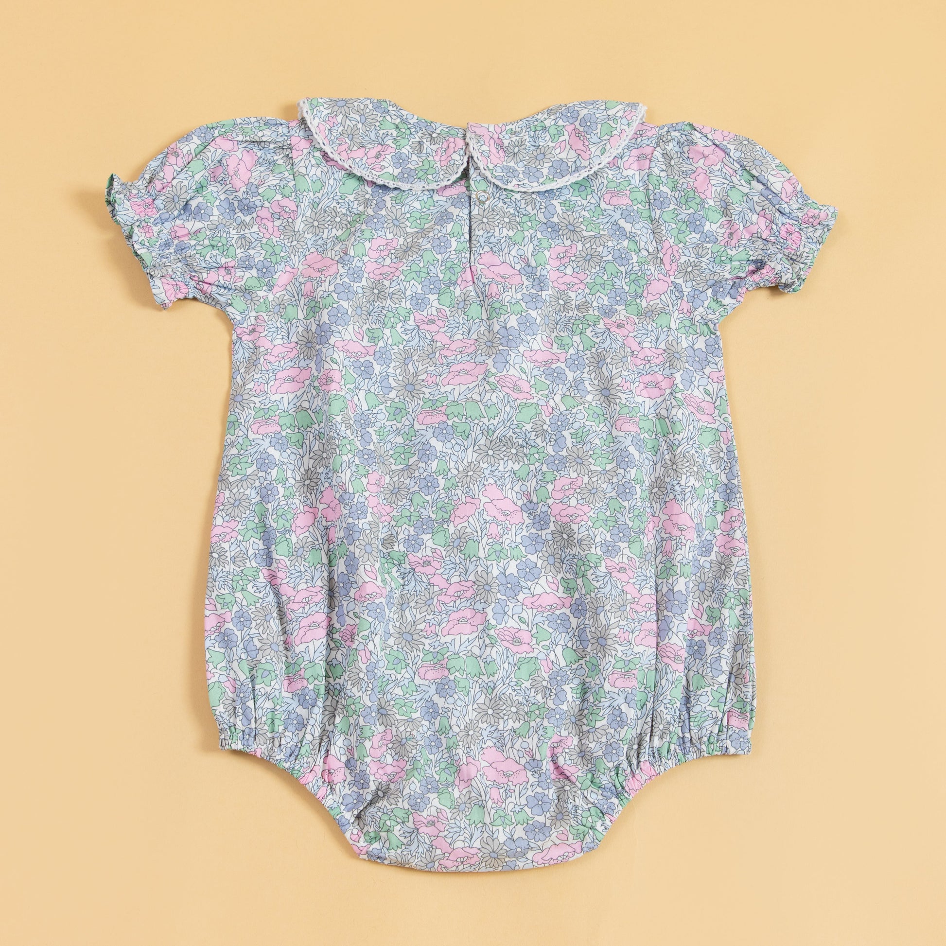 Floral design cute summer romper for babies with short puff sleeves and a peter pan collar