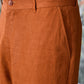 Close-up of dark camel linen trousers by Stylera featuring a buttoned waistband and side pocket
