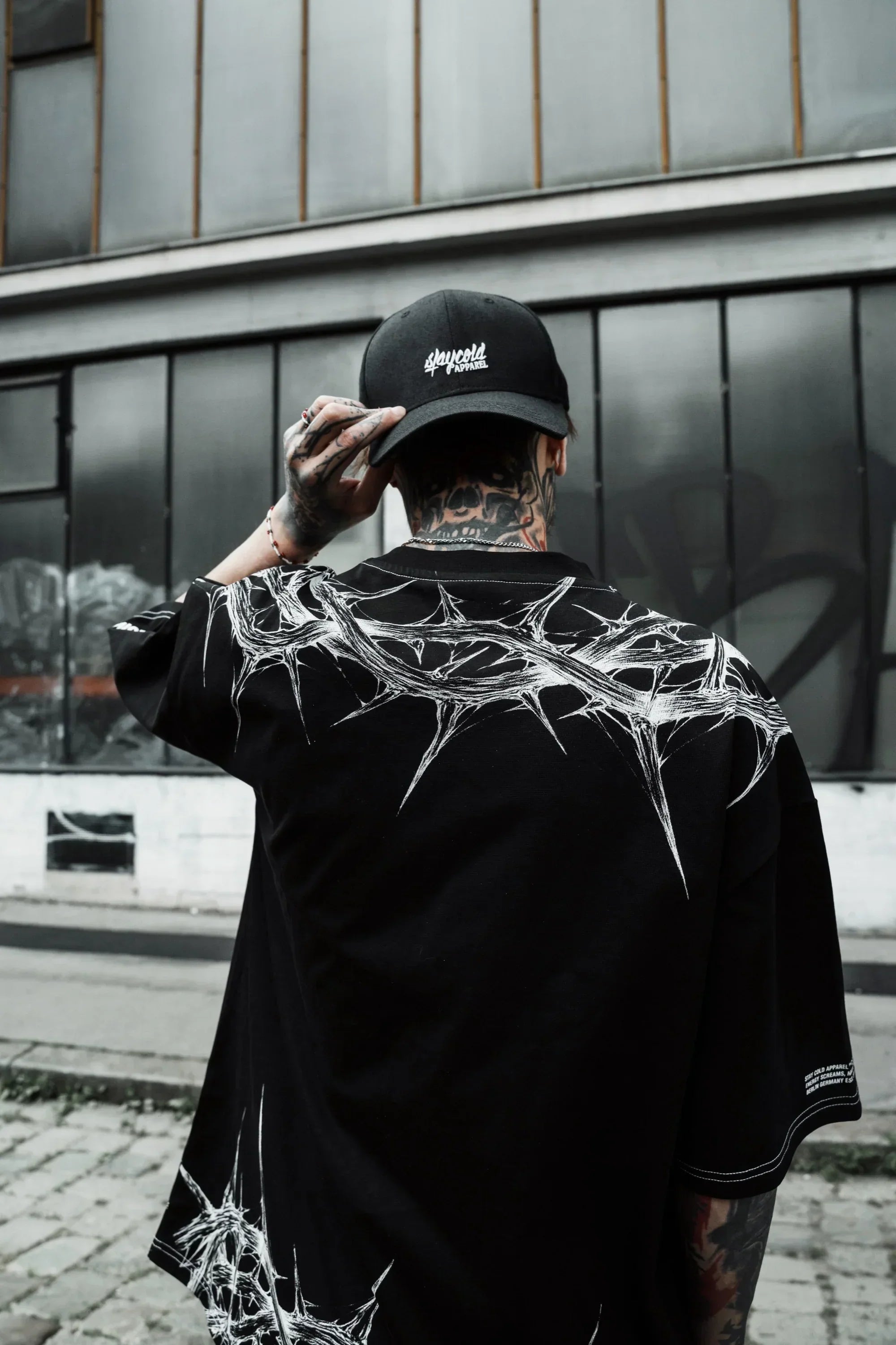 Close-up of the high-resolution, flat screen-printed thorn graphic on the dark graphic tee men.