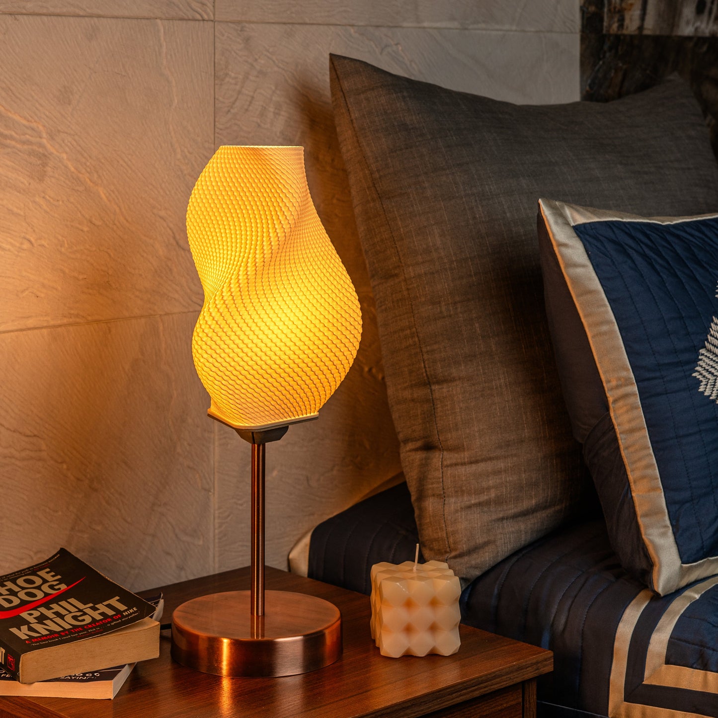 Sozori decorative bedside lamp for home with a unique swirl design and warm glow on nightstand