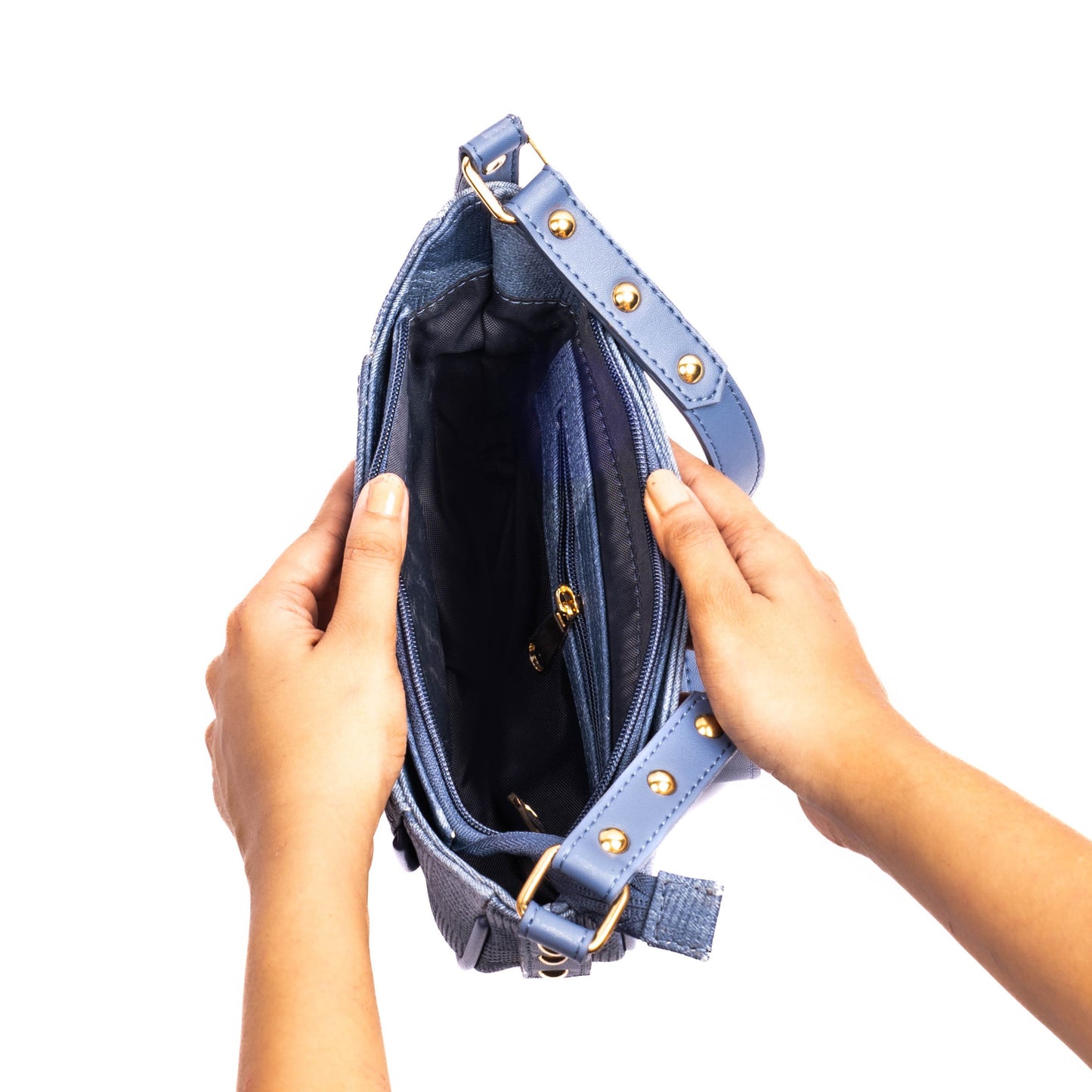 Inside view of a Stylera denim hobo bag with multiple compartments and stylish detailing