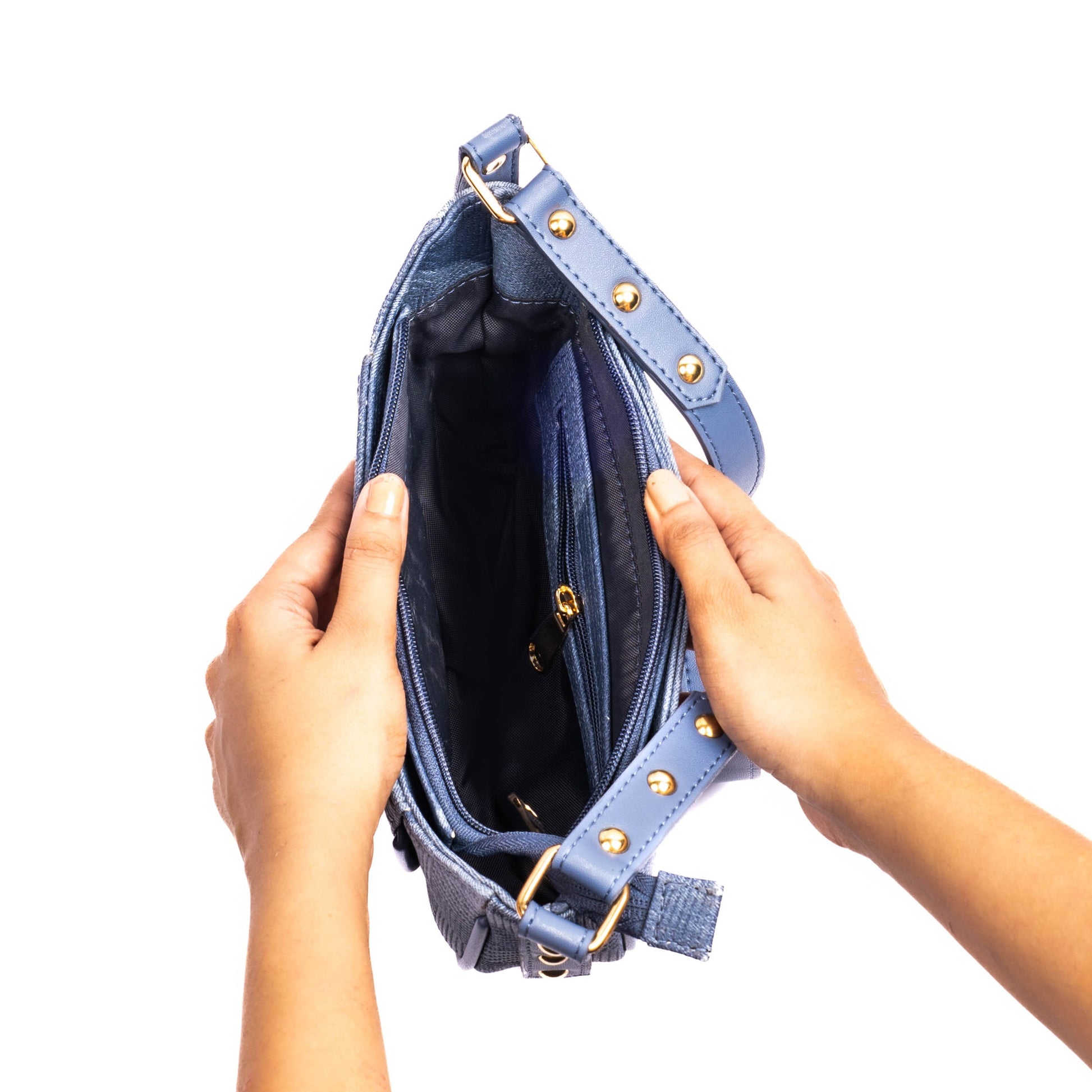 Inside view of a Stylera denim hobo bag with multiple compartments and stylish detailing