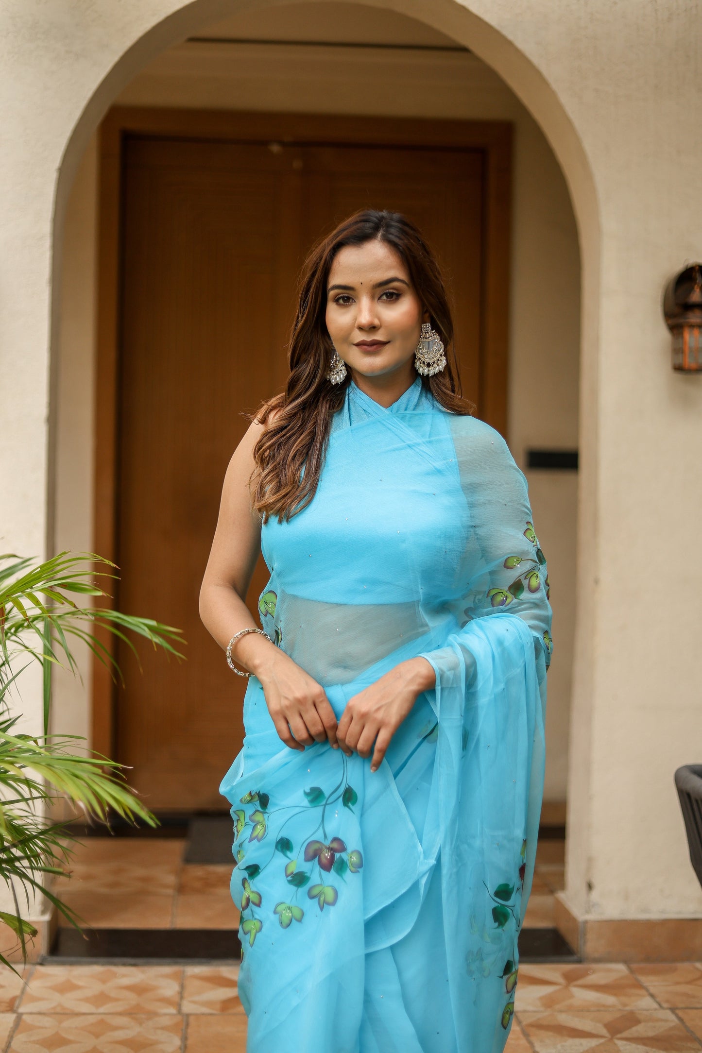 Elegant designer blue saree for women with floral embroidery and a flowing design