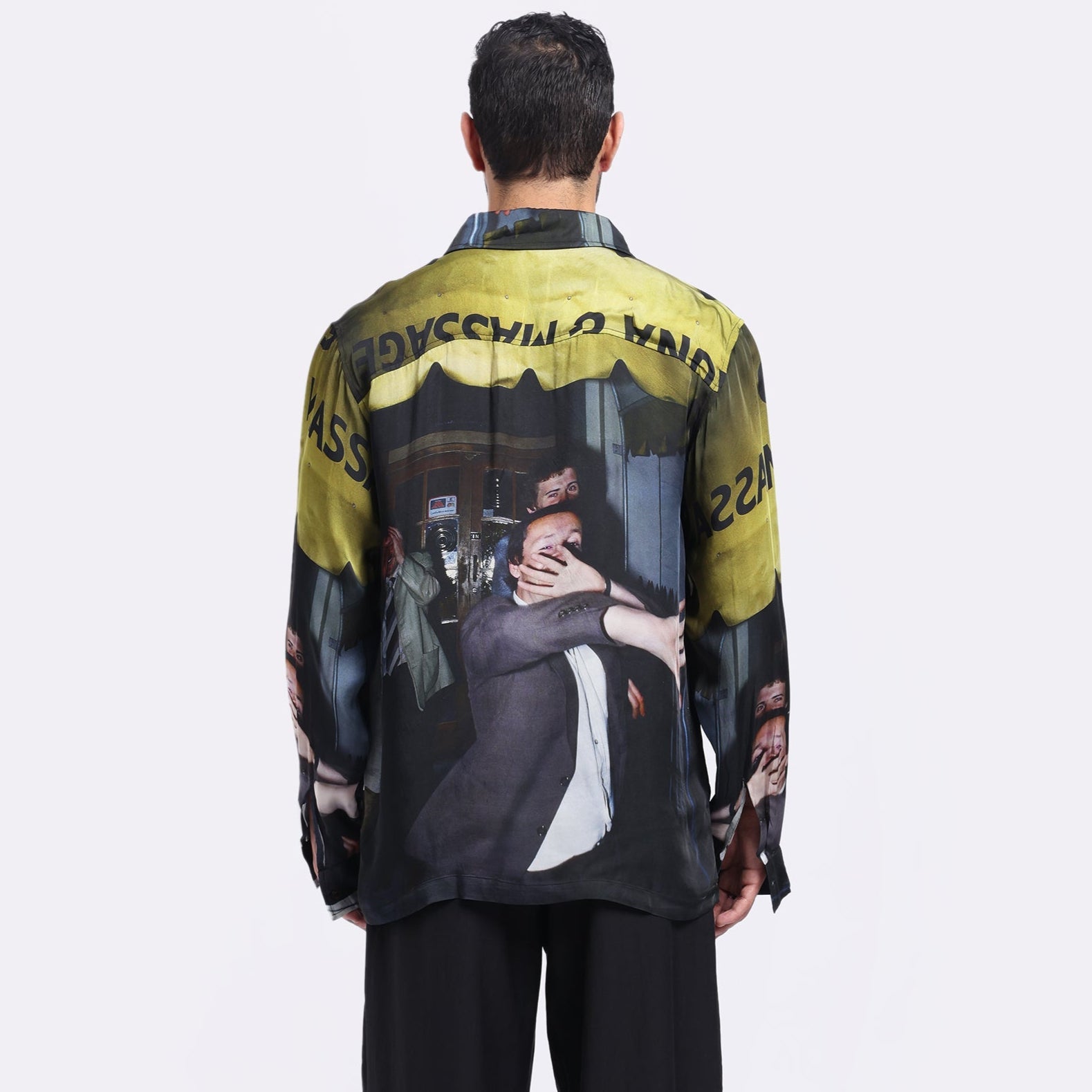 Back view of a designer casual shirt for men featuring a bold graphic print and relaxed fit