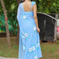 DiraByDimple designer chiffon saree with floral painting in blue, elegantly draped on a model outdoors