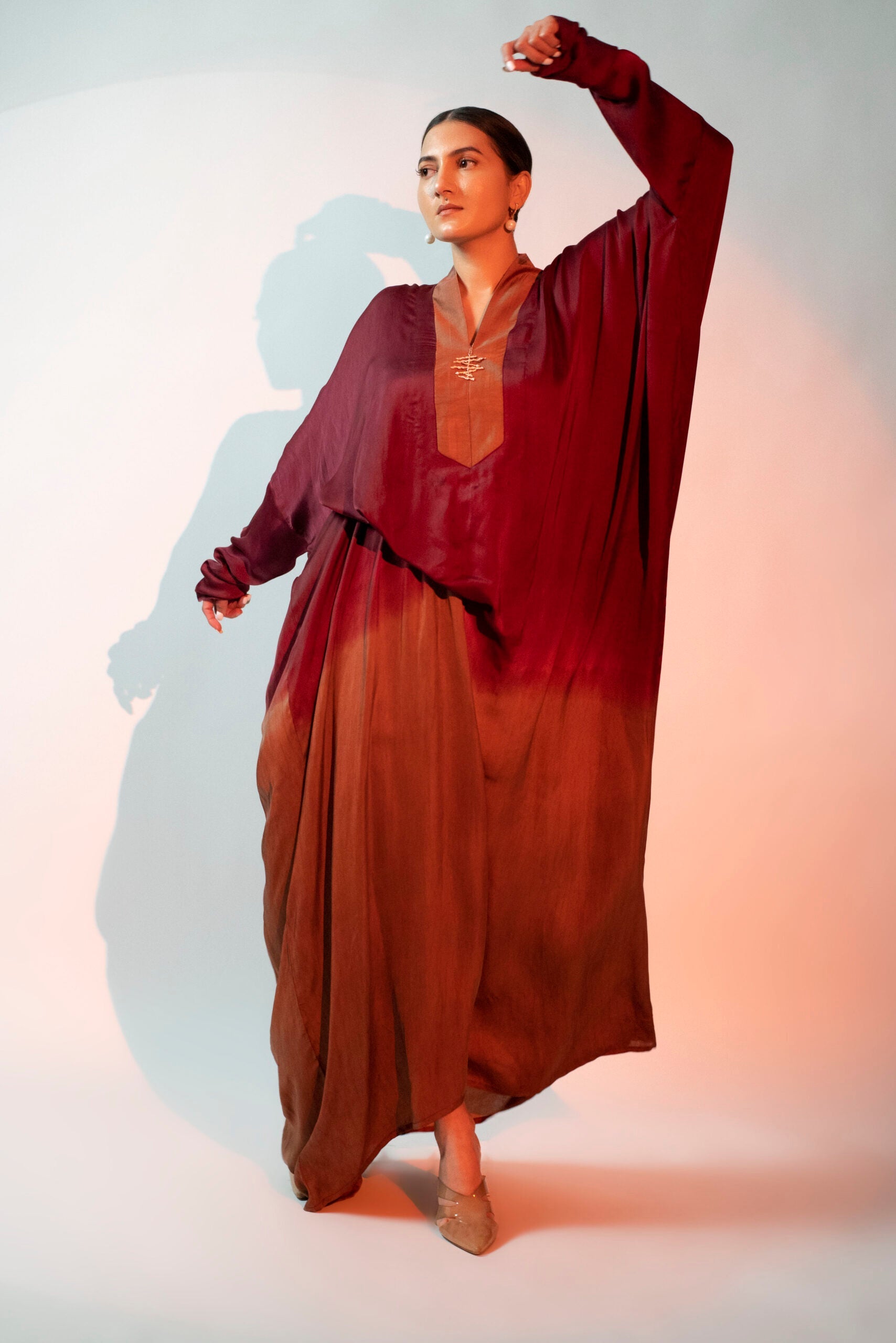 Stylera designer evening gown for women with a relaxed silhouette in burgundy and brown gradient