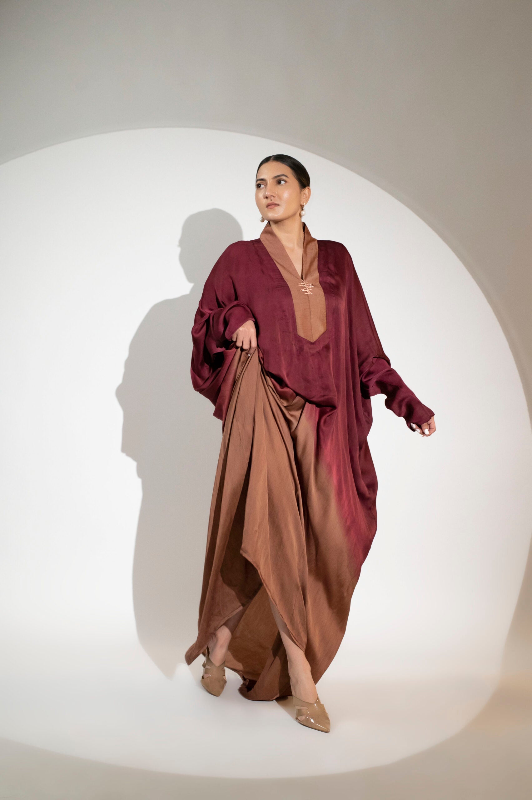 Elegant designer evening gown for women in burgundy and bronze, perfect for formal occasions