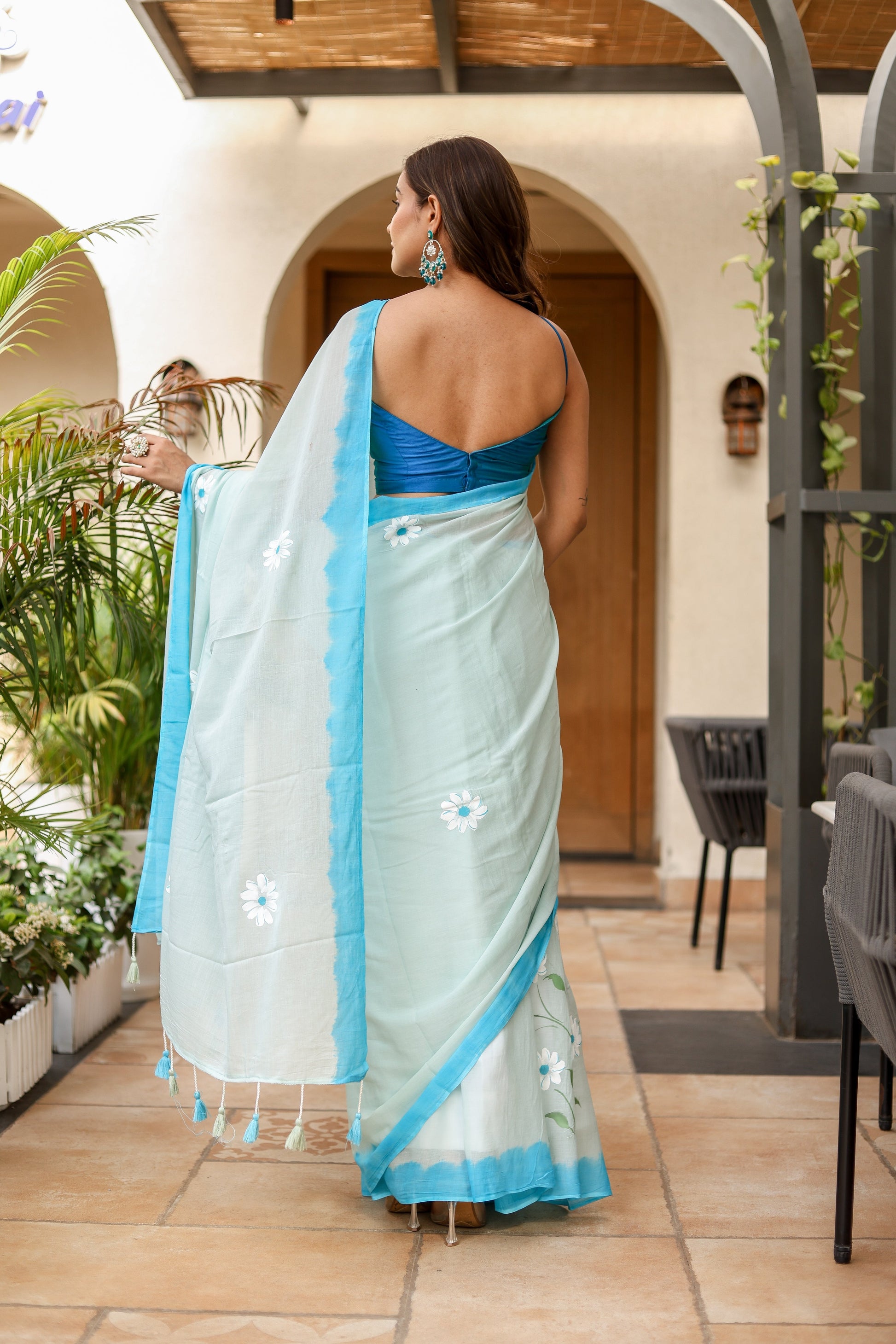 Elegant Stylera designer handpainted saree for parties with floral details and soft blue hues