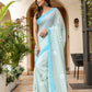 Stylera designer handpainted saree for parties in light blue with floral designs and elegant draping