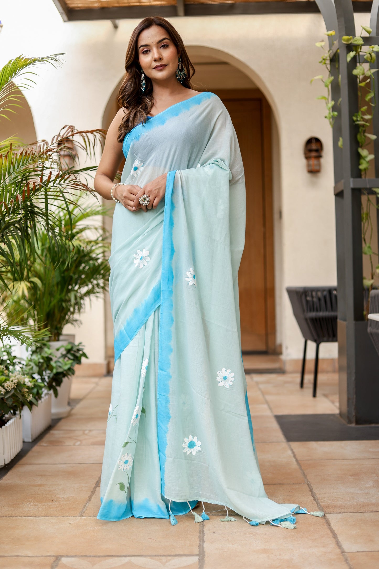 Stylera designer handpainted saree for parties with delicate floral designs in light blue tones