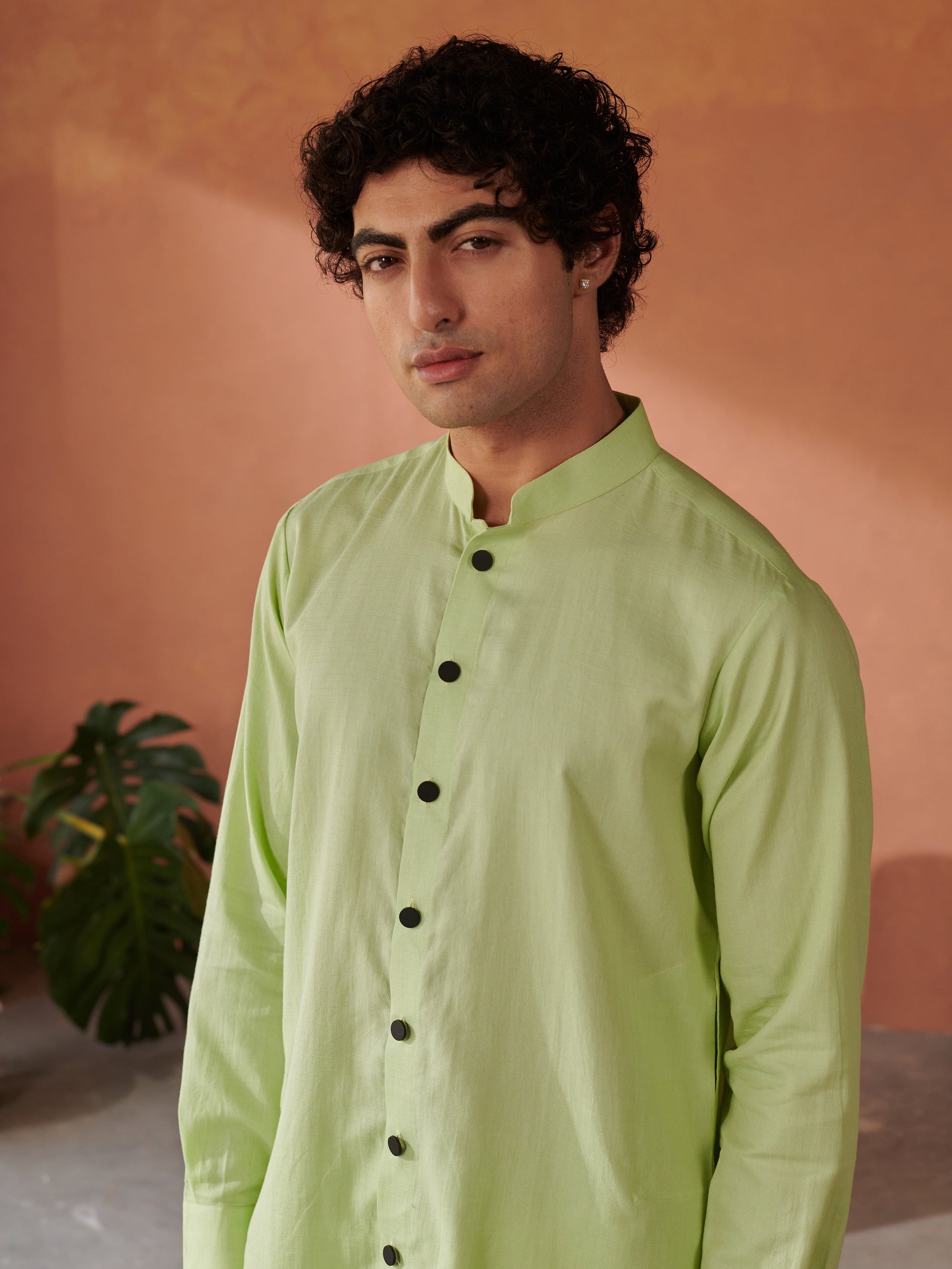 Stylera designer kurta for men in light green with stylish black buttons and a classic collar