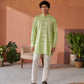 Men's designer kurta for men in light green with buttons, paired with white pants and black sandals