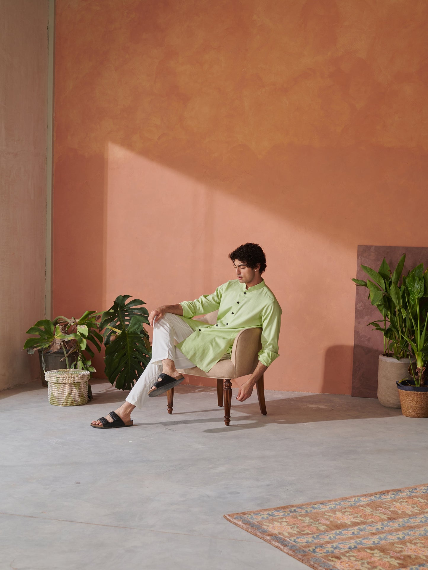 Men's designer kurta for men in light green, styled with white pants and casual footwear