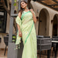 Elegant Stylera designer malmal saree with flowers in soft green, styled with matching accessories