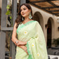 Elegant Stylera designer malmal saree with flowers in soft green, perfect for festive occasions