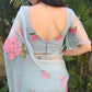 Elegant designer party wear organza saree in light blue with floral embroidery, ideal for special occasions