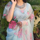 DiraByDimple designer party wear organza saree in soft blue with floral embroidery, perfect for elegant occasions