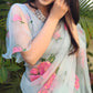 Model wearing a designer party wear organza saree with floral embroidery and elegant draping