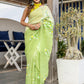 Elegant green designer party wear saree with floral embroidery, perfect for festive occasions