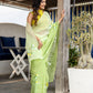 Elegant designer party wear saree in light green with floral embroidery, perfect for festive occasions