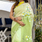Light green designer party wear saree with floral embroidery, perfect for elegant celebrations
