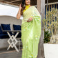 Elegant designer party wear saree in lime green with floral embroidery, perfect for festive occasions