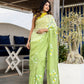 Stunning designer party wear saree in light green with floral embroidery, perfect for festive occasions