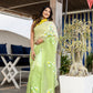 Stylera designer party wear saree in light green with floral embroidery, styled for modern celebrations
