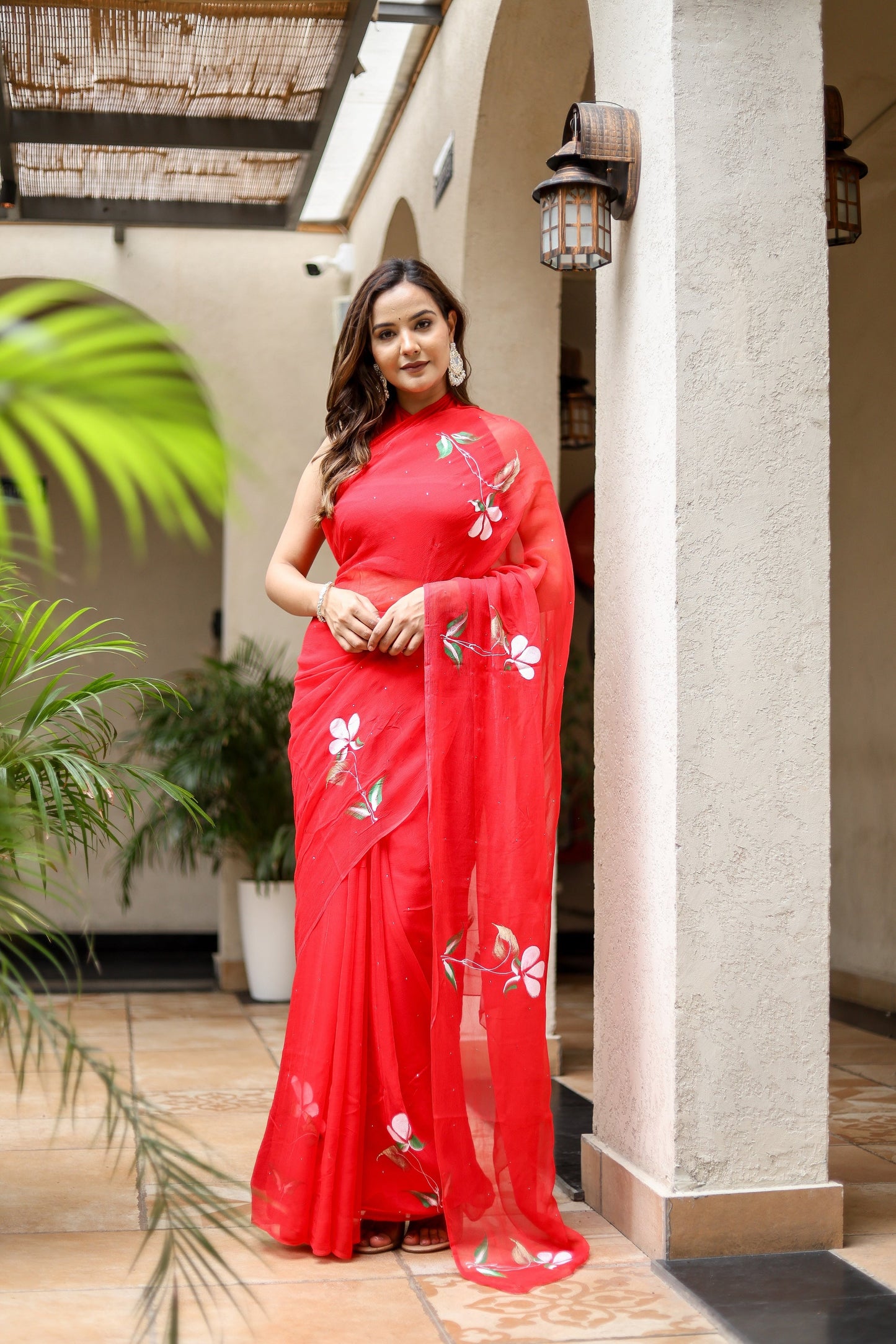 Elegant Stylera designer red saree for weddings adorned with beautiful floral embroidery
