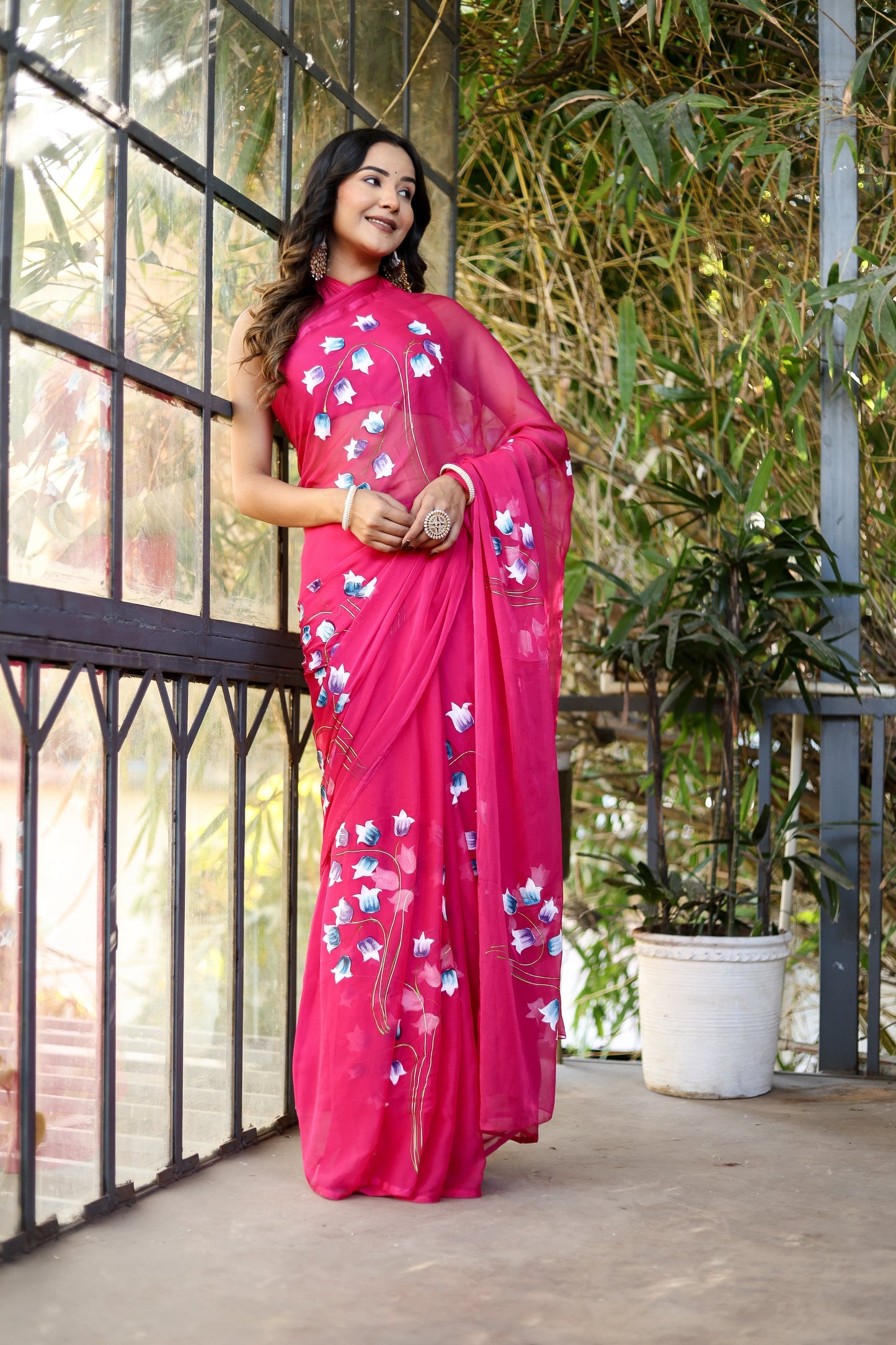 Elegant designer saree for special occasions in vibrant pink with floral embroidery details