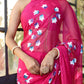 Elegant pink designer saree for special occasions featuring floral patterns and a sheer drape
