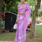Elegant designer saree for special occasions in purple with floral patterns, styled for a festive look