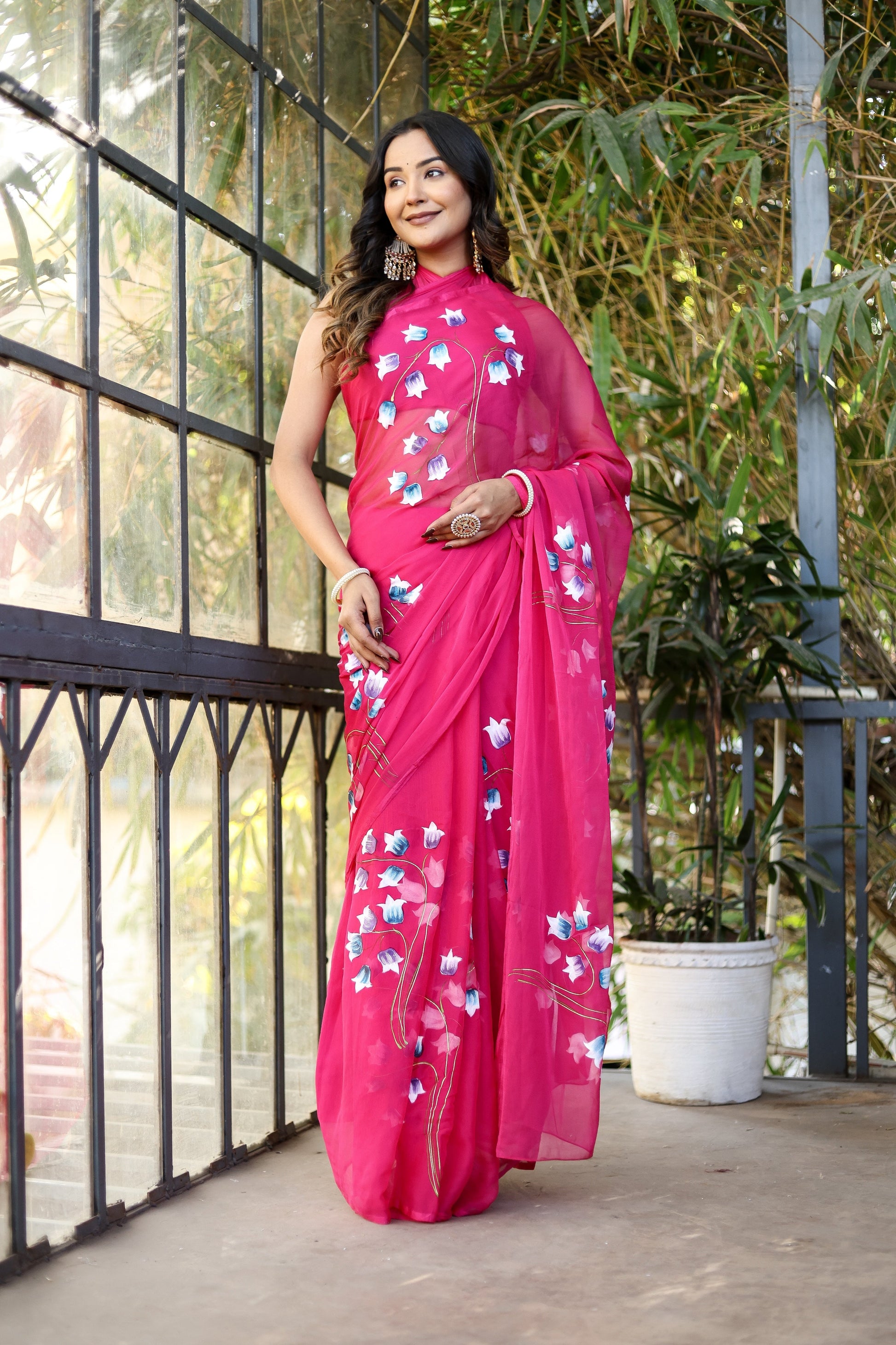 Elegant pink designer saree for special occasions with floral embroidery and light drape