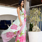Elegant designer saree for women in mint green with floral pink patterns, perfect for special occasions