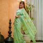 Elegant designer saree for women in light green with floral print, perfect for special occasions
