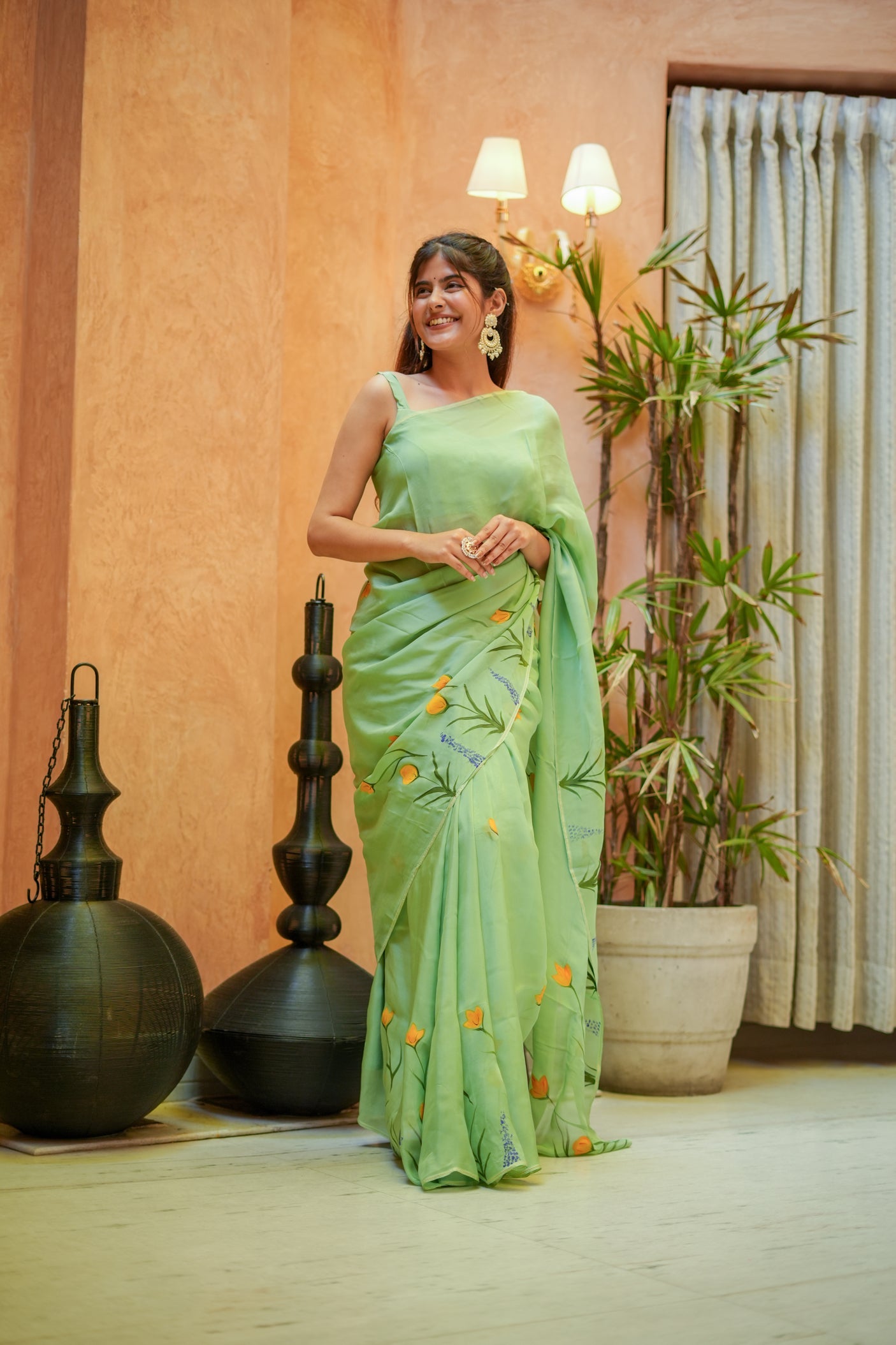 Elegant green designer saree for women with unique floral embroidery, perfect for special occasions