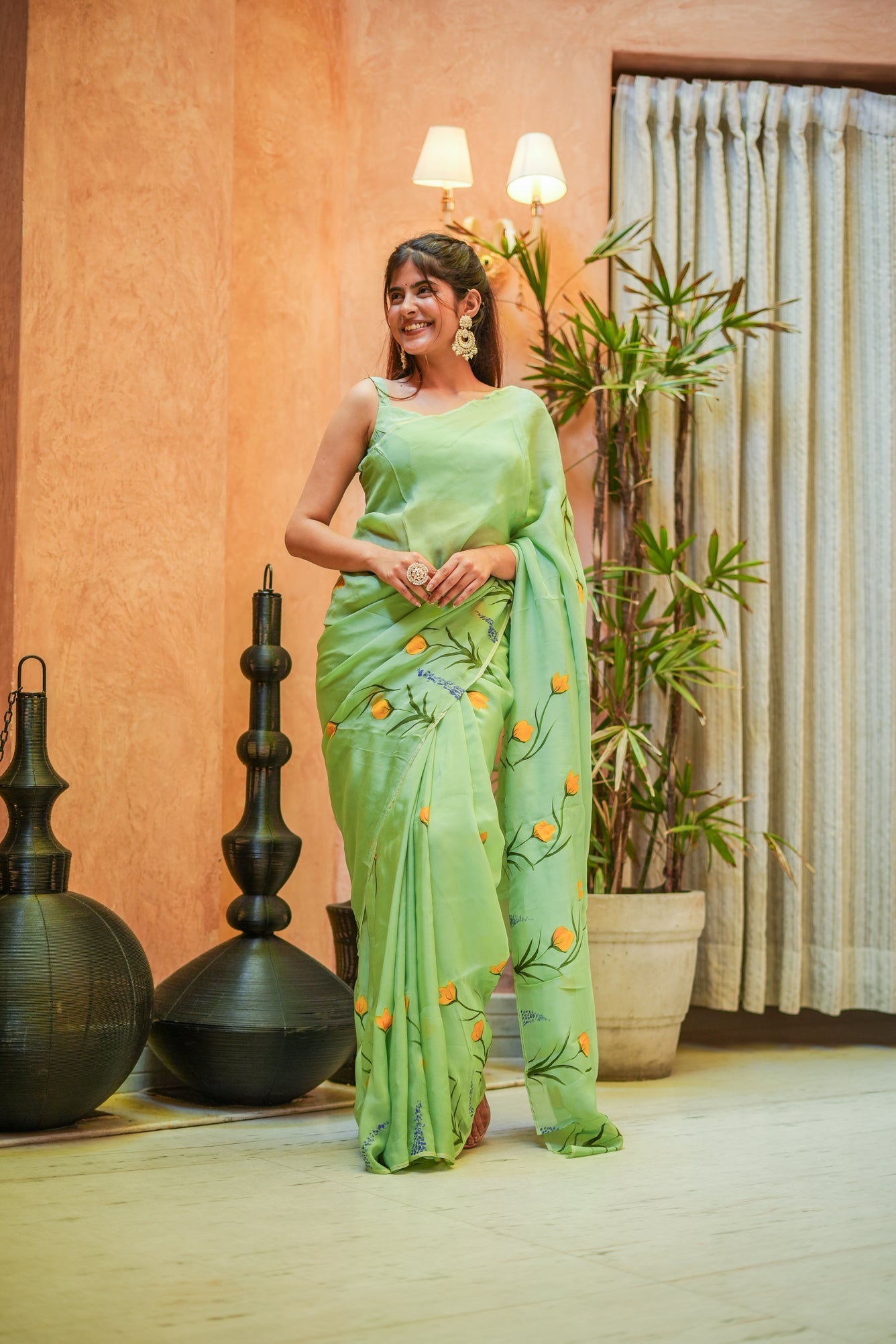 Elegant Stylera designer saree for women in green with floral embroidery, perfect for special occasions