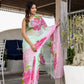 Elegant designer saree for women in light green with vibrant pink floral patterns