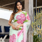 Elegant Stylera designer saree for women in pastel green with floral prints and soft draping