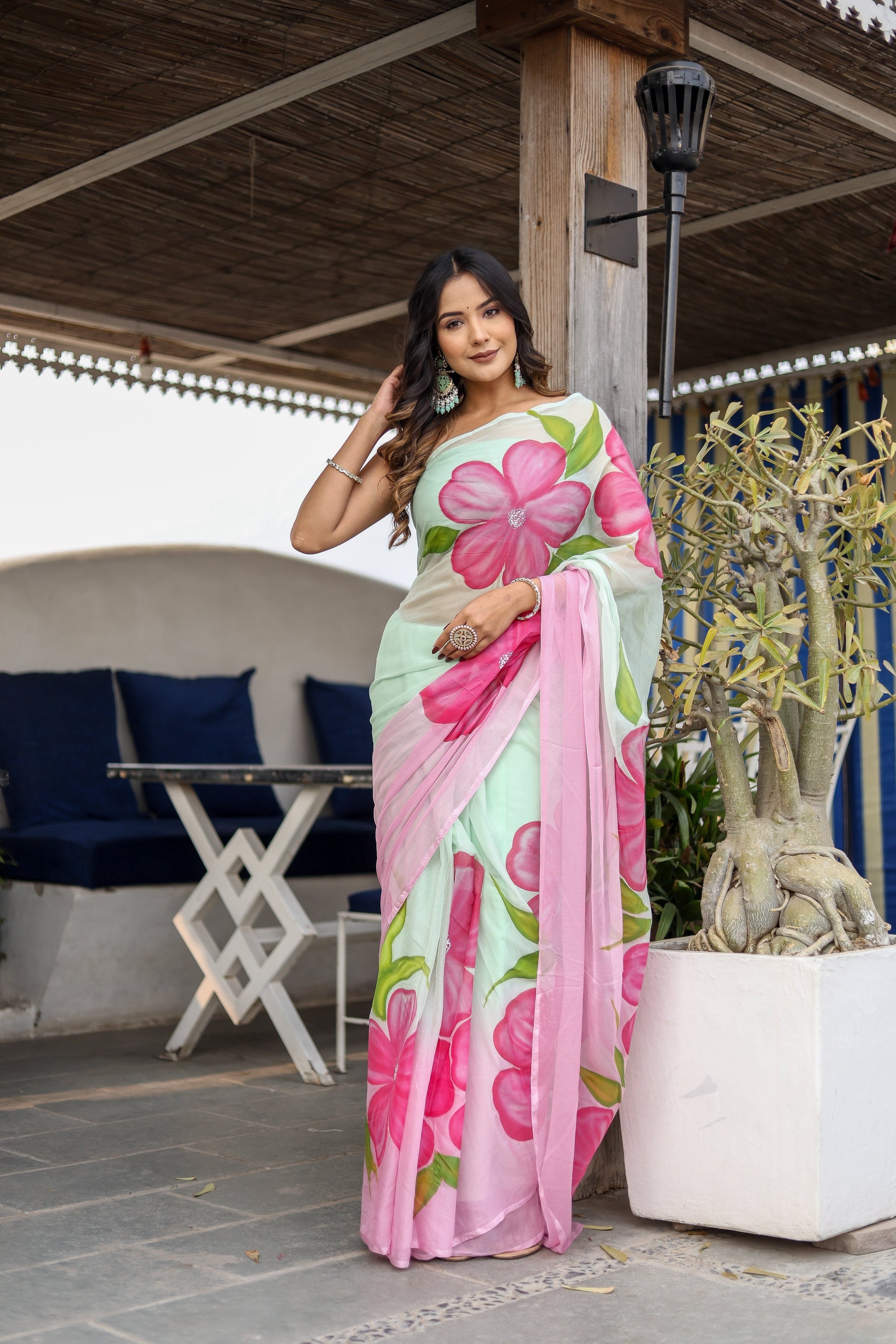 Stylera designer saree for women in mint green with vibrant pink floral patterns