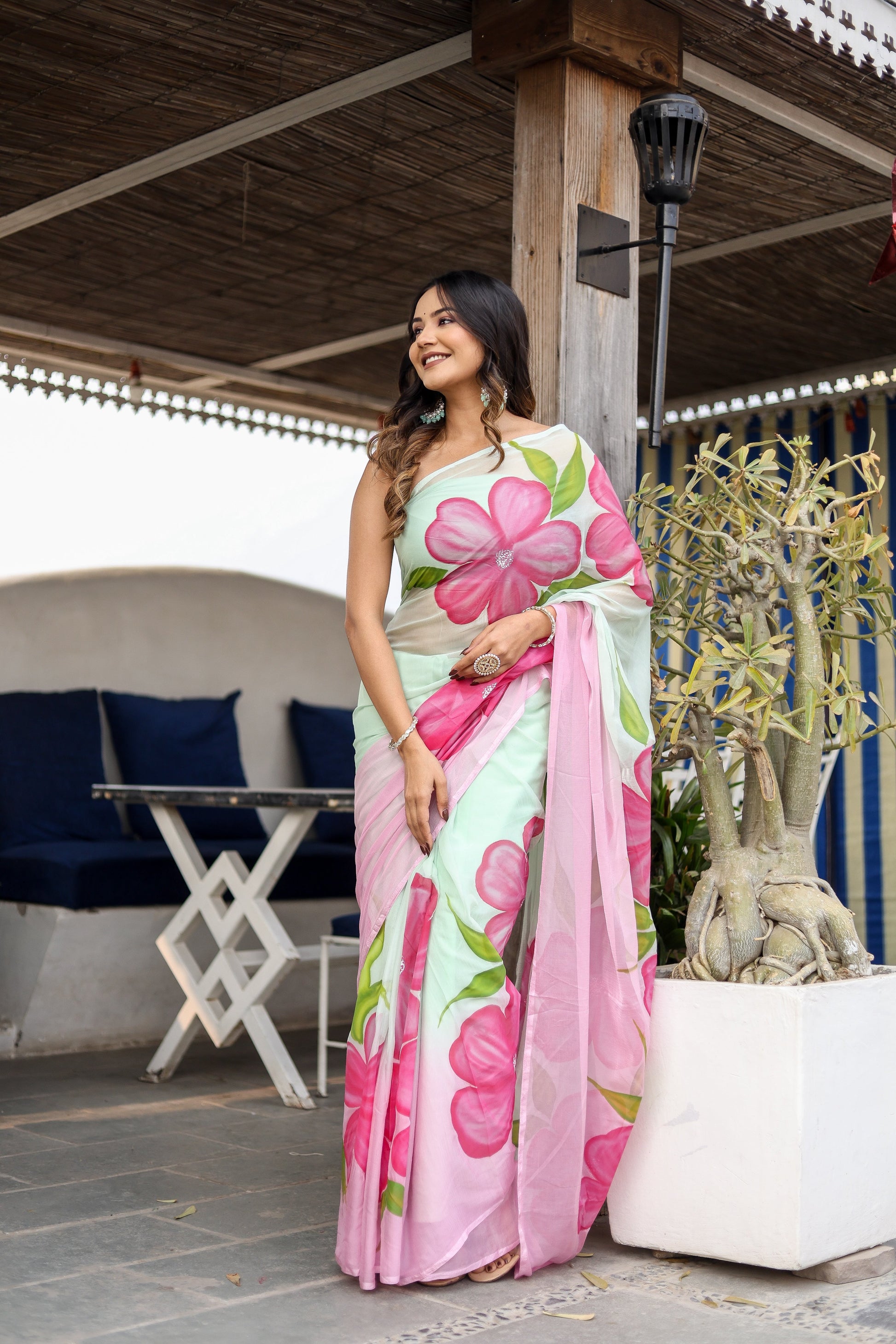 Elegant Stylera designer saree for women featuring vibrant pink floral patterns on a light fabric