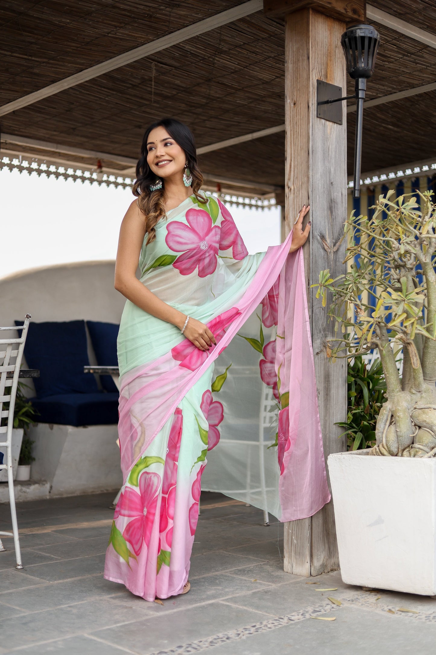 Stylera designer saree for women in pastel hues with vibrant floral prints, perfect for special occasions