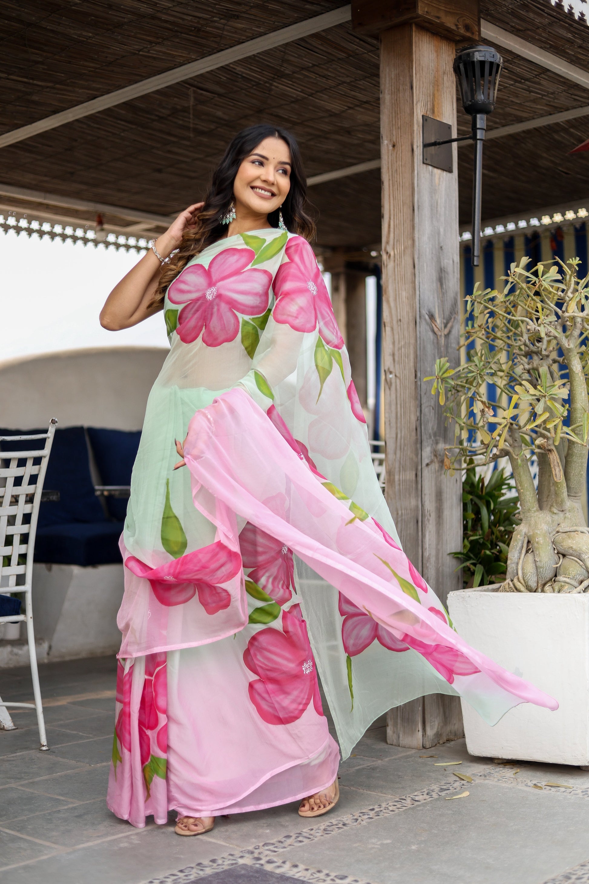 Stylera designer saree for women with vibrant pink flower patterns, perfect for festive occasions