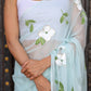 Elegant light blue designer saree with floral embroidery and sheer fabric for special occasions