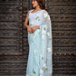 Elegant light blue designer saree with floral embroidery, perfect for special occasions
